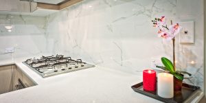 If I receive offers below my asking price for my house, should I reconsider or stick with my asking price?